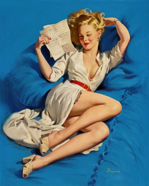 A smiling blonde woman in a white dress and red belt reclines on blue pillows reading a handwritten letter.