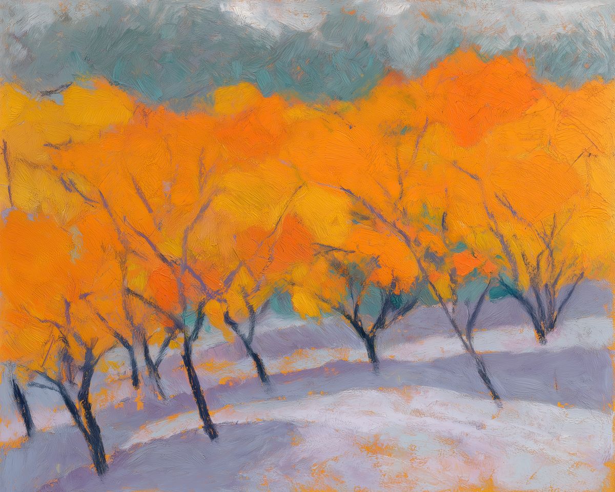 A row of autumn trees with orange and yellow foliage stands above a snow-covered ground under an overcast teal-gray sky.
