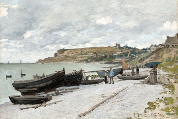 Several dark wooden fishing boats resting on a pale pebble beach with figures nearby and a chalk headland village in the back