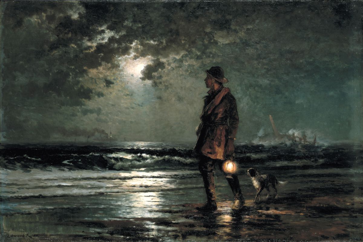 A man holding a lantern stands on a moonlit beach with a small dog beside him, looking out at a rough sea at night.