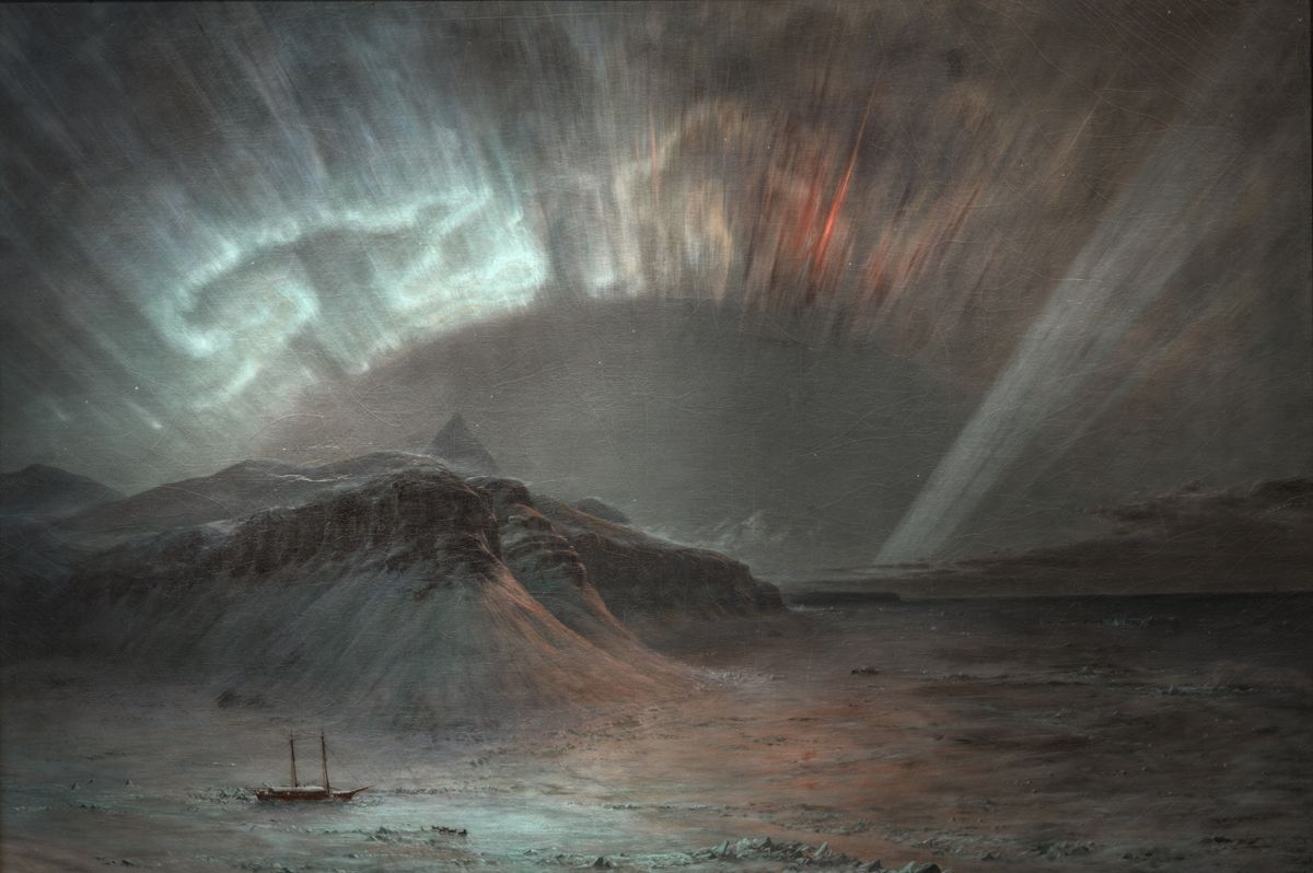 A small sailing ship on a dark Arctic sea beneath a sweeping aurora borealis with mountains in the background.