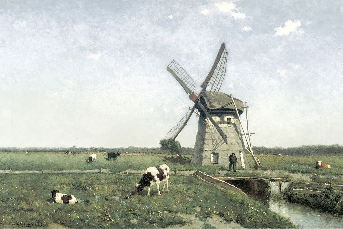 A Dutch windmill in a flat green polder landscape with grazing cattle, a narrow canal, and a small human figure at its base.