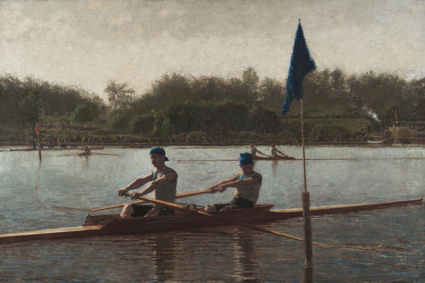 Two men rowing a double scull on a river during a regatta, with a blue flag marker in the foreground and spectators on the fa